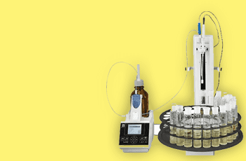 A yellow background with some bottles and a machine