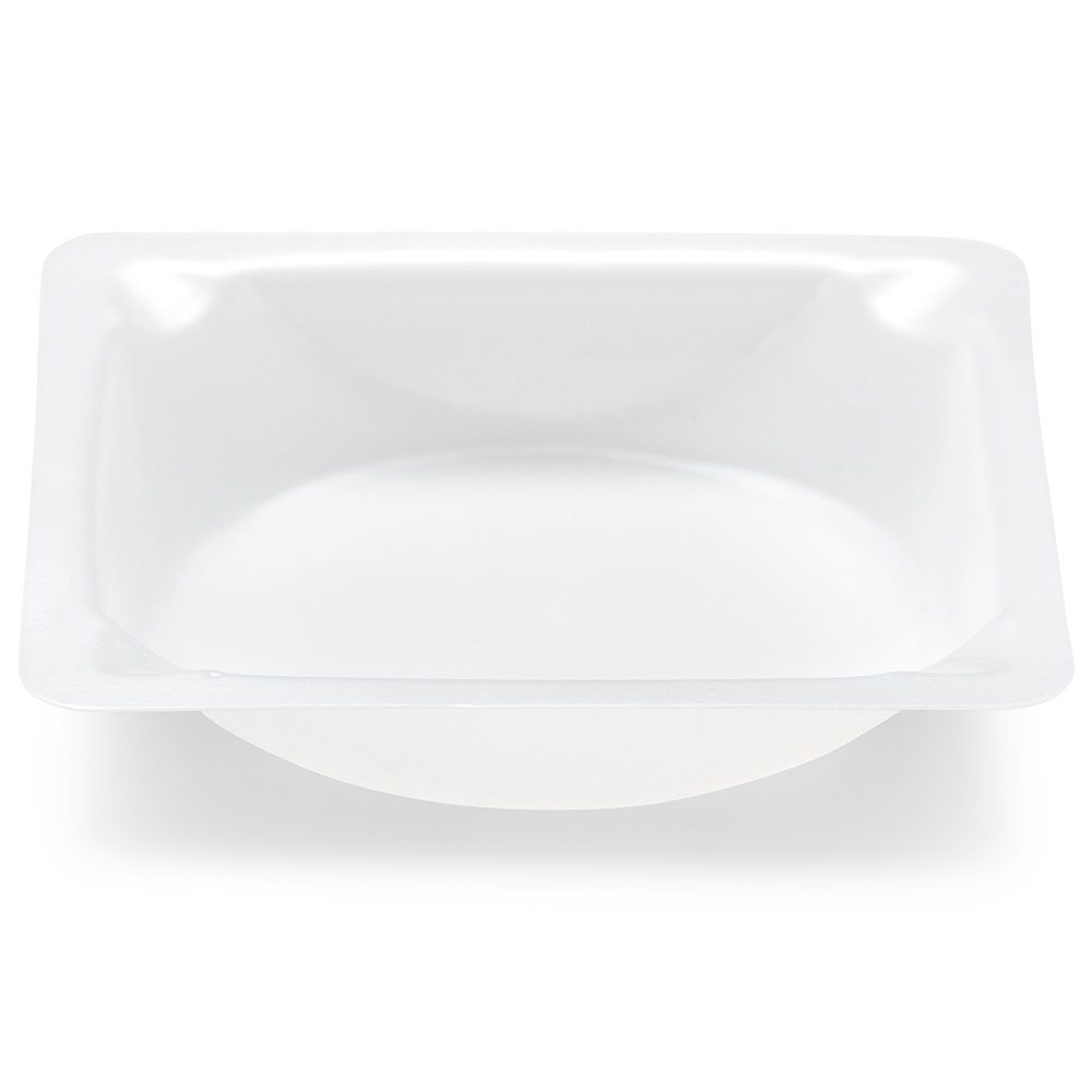 A white bowl with a lid on top of it.