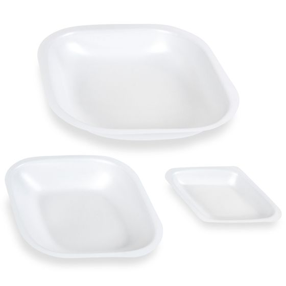 A group of three white trays sitting next to each other.