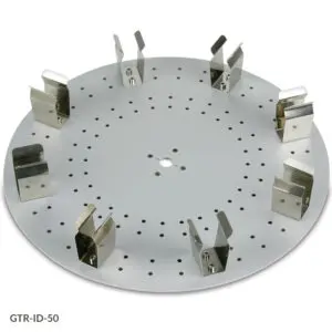 A white plate with holes for placing metal parts.