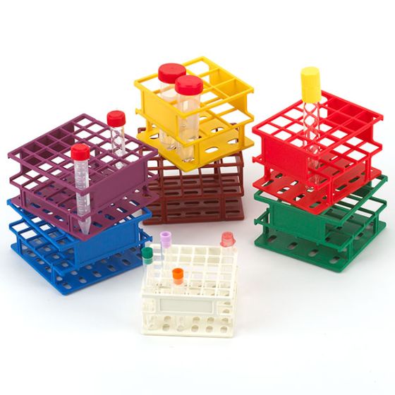 A group of plastic racks with bottles in them.